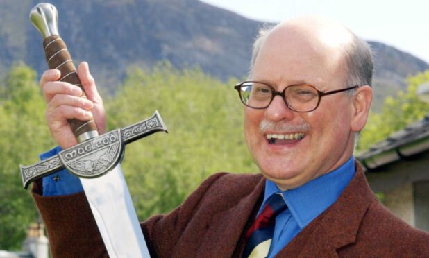 Dr Roddy MacLeod of Ballachulish with the presentation sword he received to mark his retirement. Photo by Ian Ferguson.