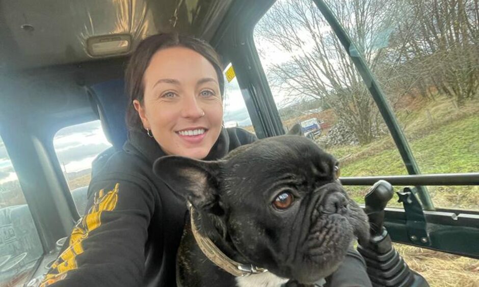A selfie of Digger Girl Amy in a digger with her French Bulldog Dipper. 