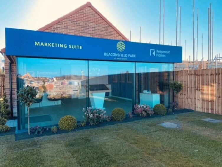 An illuminated marketing suite with fascia signage is attractive and eye-catching.