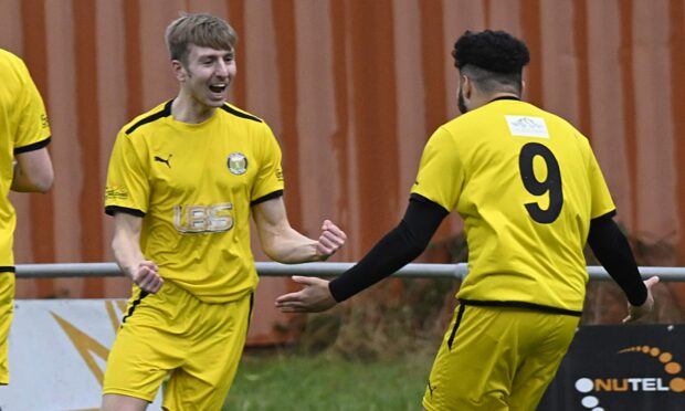 Fort William's Andy MacLean and Shaqille Wynter-Cole celebrate their joint attack which resulted in Fort's first goal in Saturday's 4-2 win against Alness United.  Images: Iain Ferguson, The Write Image