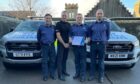 Senior Coastal Operations Officer (SCOO) Colin Willis, Chief Inspector Stuart Clemenson, Area Commander Dave Sweeney and SCOO Dan O'Connor at an informal ceremony to hand over the Certificate of Recognition. Image: HM Coastguard.