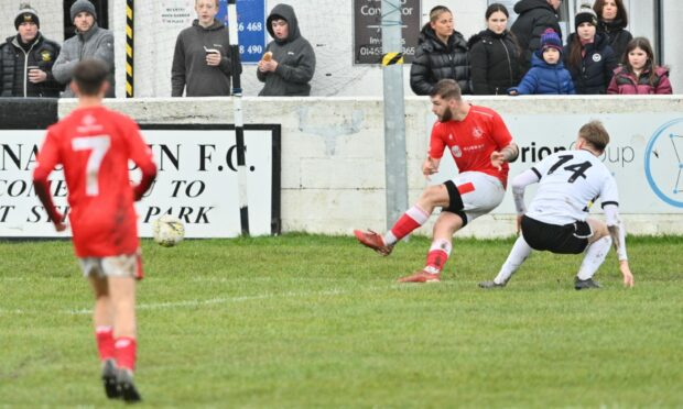 Ciaran Young nets for Nairn County from an acute angle to make it 2-0 against Clach at Grant Street Park. Image: Jason Hedges/DC Thomson