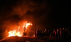 Burning of the Clavie in Burghead makes a comeback to its original date with a huge flock of people turning up for the ancient New Year event. Picture by Jason Hedges / DC Thomson