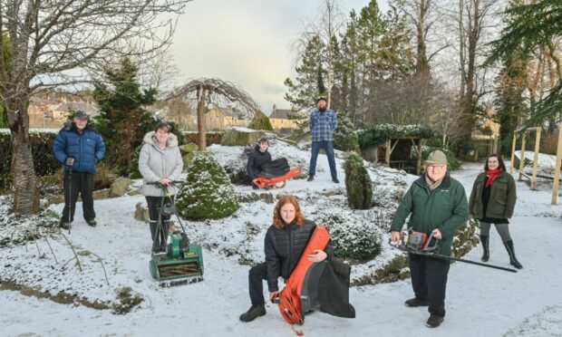 The Friends of the Elgin Biblical Garden group have secured £9,000 in government funding to pay for new eco-friendly equipment like leafblowers, lawnmowers, and more to replace their current fossil-fuelled appliances. Their chairman John Sherry is pictured within the gardens along with two classes of UHI Moray horticultural students. Images: Jason Hedges/DC Thomson
