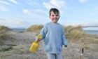 Four-year-old Daniel Grant from Forres plays in the sand on a mild winter's day in Findhorn. Image: Jason Hedges / DC Thomson.