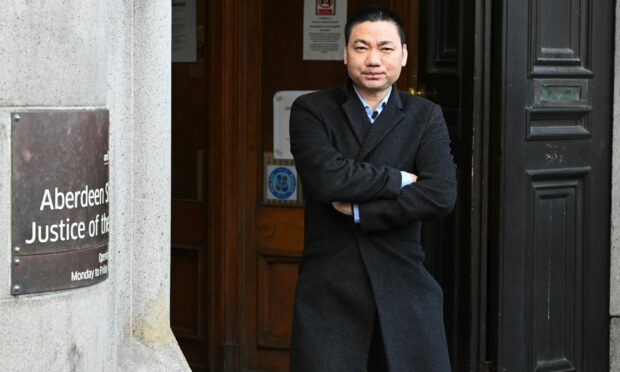 Wengang Liu leaving Aberdeen Sheriff Court. Image: DC Thomson