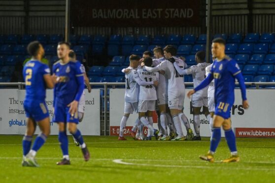 Ayr United players congratulate goalscorer Nick McAllister against Cove Rangers. Image: Kenny Elrick/DC Thomson