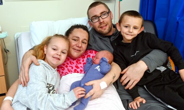 Samantha Morrice and Sean Innes with baby Cody and his sister Stevie and brother Luke. Image: Kath Flannery/DC Thomson.