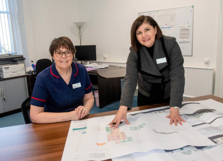 Director of Clinical Services Karen Benton and Bets Welman looking over the Albyn Hospital expansion plans.