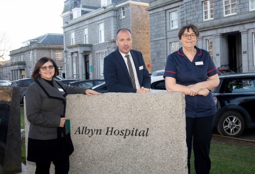 Bets Welman, Operations Manager Euan McIntyre and Director of Clinical Services Karen Benton at the front of the hospital 