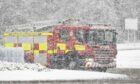 A fire engine and crew from Fraserburgh were rescued by coastguard teams after the vehicle slid into a ditch. Image: Derek Ironside/ Newsline Media.