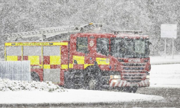 A fire engine and crew from Fraserburgh were rescued by coastguard teams after the vehicle slid into a ditch. Image: Derek Ironside/ Newsline Media.