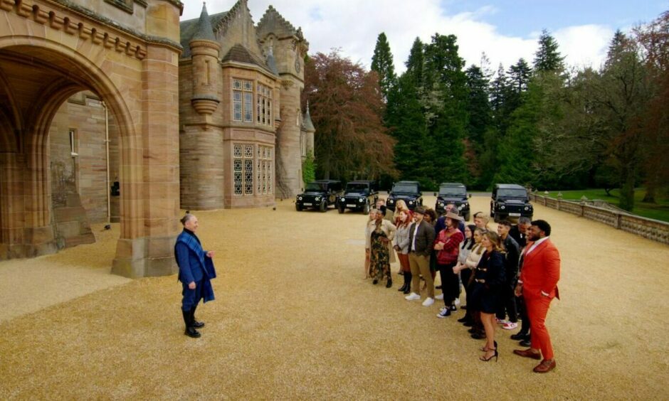 The Traitors US cast and host Alan Cumming gather outside Ardross Castle in the Scottish Highlands.