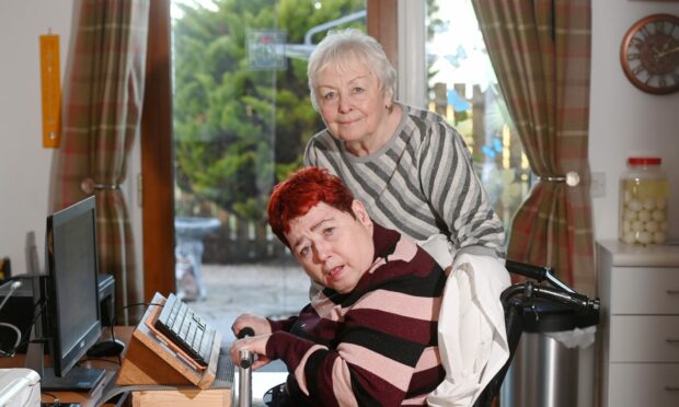 Elaine Rand with her daughter Marie who has been waiting for cataracts removal for over a year. Image: 
Darrell Benns / DC Thomson.