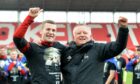Sheffield United's Paul Coutts (left) and manager Chris Wilder celebrate promotion to the Premier League in 2019. Image: PA