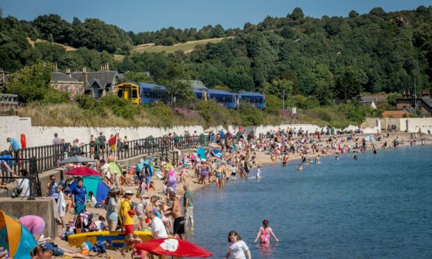 Burntisland Beach in Fife packed out with vistors and holiday makers enjoying the 27 degrees in August last year.