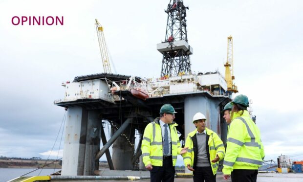 Prime Minister Rishi Sunak (second left) and Scottish Secretary Alister Jack (second right) during a visit to the Port of Cromarty Firth, Invergordon (Image: Russell Cheyne/PA)