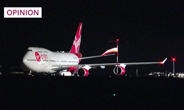 A repurposed Virgin Atlantic Boeing 747 aircraft, carrying Virgin Orbit's LauncherOne rocket, prepares for take off at Spaceport Cornwall