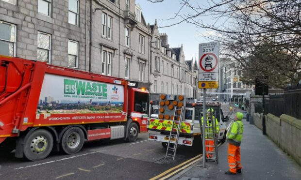 New signs for the pedestrianised zone on Schoolhill were put 
 up this morning, but have since been covered up with black bin bags. The changes will ban general traffic from the area. Image: Kieran Beattie/DC Thomson,11/01/2023.
