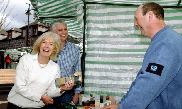 Robert Nairn of Strawberry Grange Fruit Farm with customers Jackie and Hugh Richies in 2002. Image: Colin Rennie