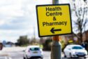 Sign pointing to local Dickies Pharmacy in Aberdeen