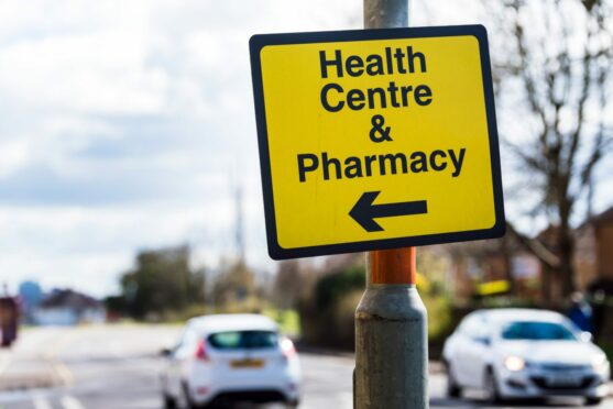 Sign pointing to local Dickies Pharmacy in Aberdeen