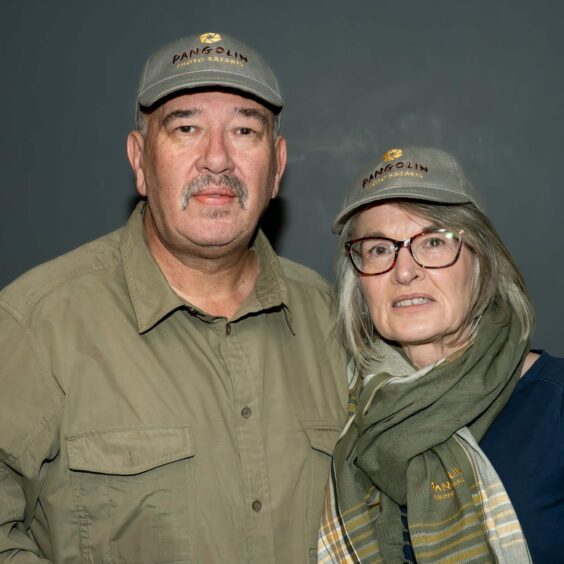 Owen and Evelyn Cochrane standing next to each other in their safari clothing