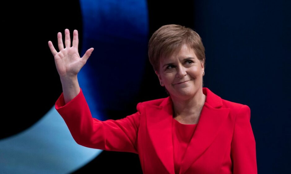 Nicola Sturgeon waving
