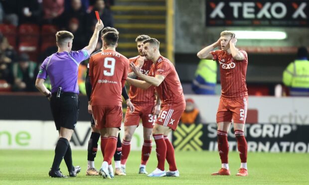 Ross McCrorie (2) of Aberdeen is shown a red card after a VAR check against St Mirren. Image: Shutterstock