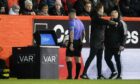 Referee Grant Irvine consults the VAR monitor before sending off Aberdeen's Ross McCrorie against St Mirren. Image: SNS