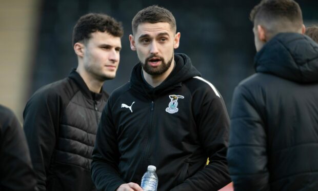 Robbie Deas with the Caley Jags squad on arrival at Livingston on Saturday. Images: Paul Devlin/SNS Group