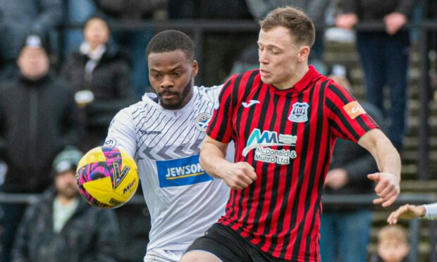 Angus Mailer (right) challenges Ayr United's Dipo Akinyemi in last week's 4-1 Scottish Cup extra-time defeat for Elgin City. Images: Photo by Euan Cherry/ SNS Group