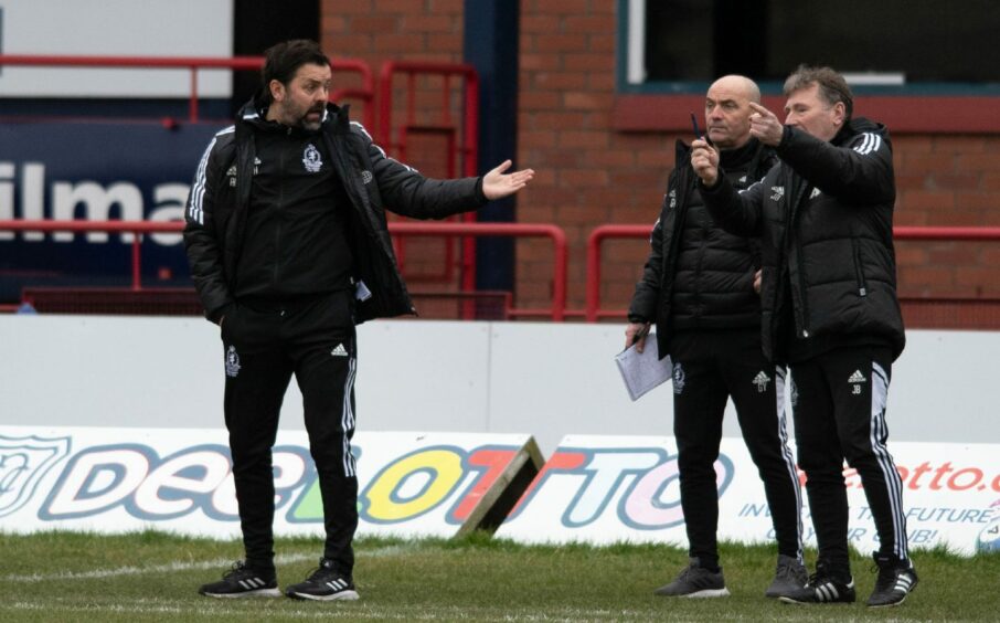 The Cove Rangers coaching staff pass on instructions. Image: SNS