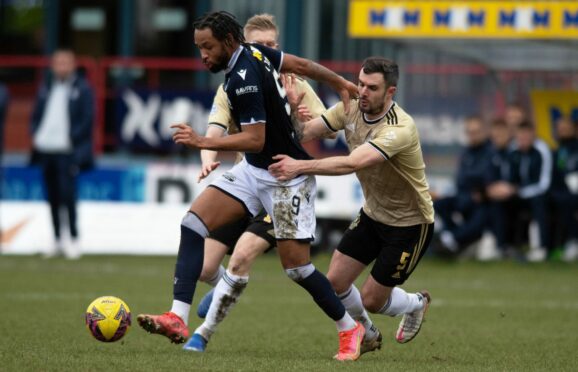 Cove Rangers defender Scott Ross battles with Dundee's Kwame Thomas. Image: SNS