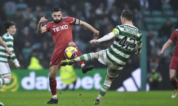 Aberdeen's Graeme Shinnie and Celtic's Callum McGregor both go for the ball in a 4-0 loss. (Photo by Ross MacDonald / SNS Group)