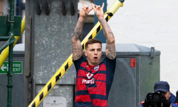 Eamonn Brophy celebrates netting Ross County's opener against Dundee United. Image: SNS