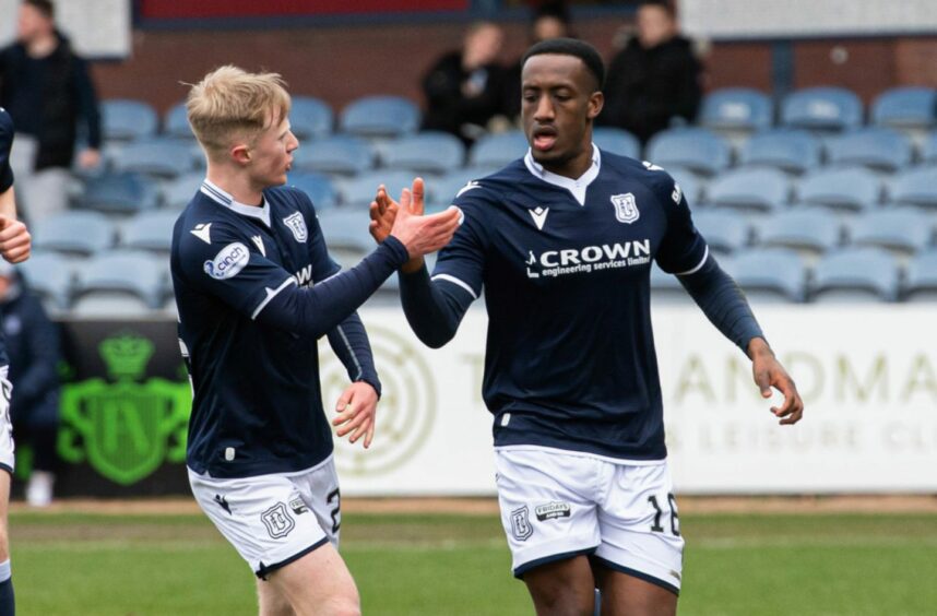 Dundee's Zach Robinson (R) celebrates scoring to make it 1-0 against Caley Thistle. Image: SNS