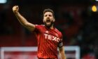 Aberdeen captain Graeme Shinnie celebrates at full-time after beating Livingston 1-0 at Pittodrie. Image: SNS.