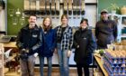 Megan Scott, centre, and the cast and crew of BBC Scotland's Eat the Town when they visited Megan's Wholehearted shop in Fraserburgh to film last year. Image: Megan Scott