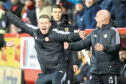 Aberdeen coaching duo Barry Robson and Steve Agnew celebrate against Motherwell. Image: Stephen Dobson/ProSports/Shutterstock (13754167ac)