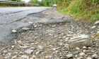 Picture by SANDY McCOOK   2nd September '22
CR0037827
Dangerous verges and potholes on the A890 between Loch Carron and Kyle of Lochalsh close to the avalance shelter, an area prone to landslips and road closures.