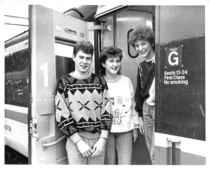 1987 - 1987 - Heading for a long weekend in London were Banff Academy pupils Norman Meldrum and Fiona McWhirr, runners-up in the final of the schools debating competition organised by the Press and Journal and Aberdeen University. The two were accompanied by English teacher Miss Alison Johnston, right.