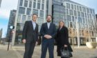 l-r Bob Ruddiman, partner and head of energy, Burness Paull, Aberdeen City Council finance and resources convener Alex McLellan and Tricia Walker, partner, Burness Paull, outside the new home of Burness Paull in Aberdeen. Image: Aberdeen City Council