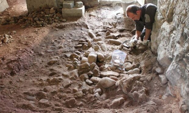 Nick Goldthorpe of Applecross Archaeological Society during the excavation at the Old Estate Office. Image: Cathy Dagg.