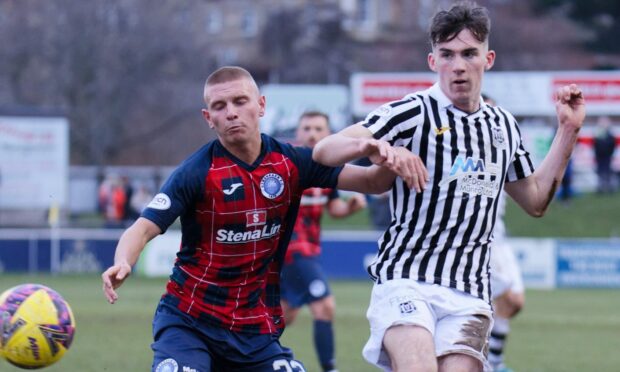 Evan Towler battles for the ball while on loan at Elgin City.