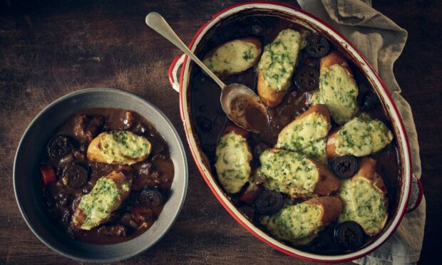 Beef bourguignon with a cheesy garlic bread topping. Image: Supplied by Opies