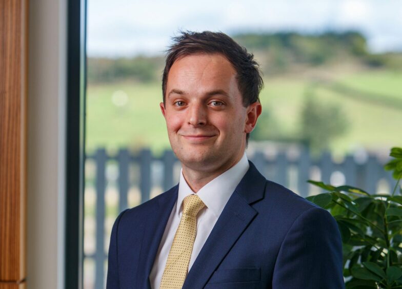 Chartered financial planner Christopher Hewson poses for a photo