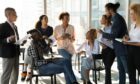 group of young professionals gather for a meeting