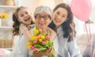 three generations of women pose for a photo to celebrate Mother's Day in Aberdeen 2023