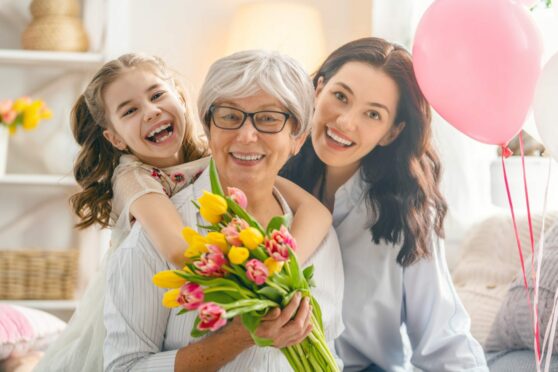 three generations of women pose for a photo to celebrate Mother's Day in Aberdeen 2023